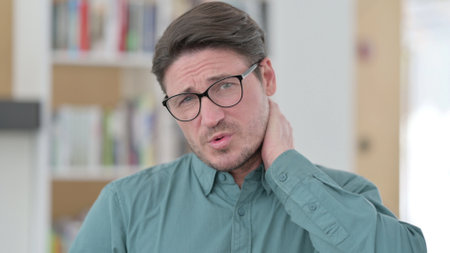 Middle Aged Man having Neck Pain, Injuryの写真素材