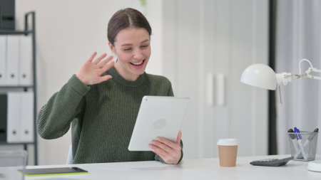 Young Woman Talking on Video Call on Tabletの写真素材