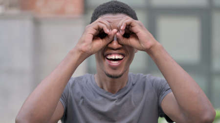 Portrait of Curious Young African Man Searching for Opportunities