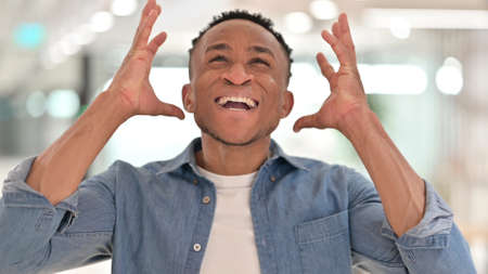 Portrait of Angry Casual African Man Shouting, Screaming