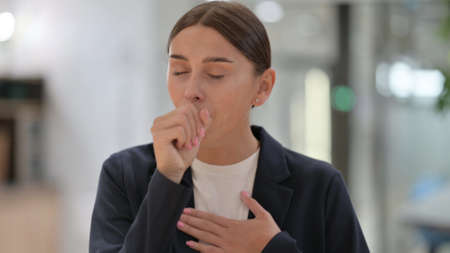 Portrait of Sick Businesswoman Coughing, Throat Painの写真素材