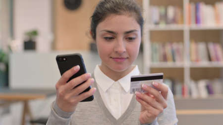 Online Payment on Smartphone by Young Indian Womanの写真素材