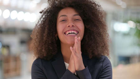 Excited Young African Businesswoman Celebrating Success