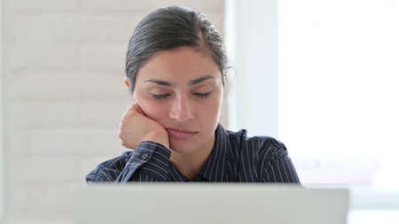 Close up of Sleeping Indian Woman with Laptop