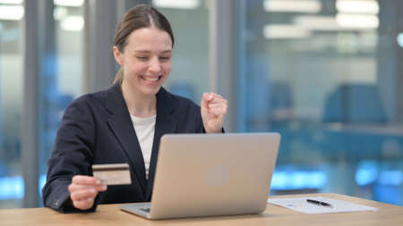 Successful Online Shopping on Laptop by Young Businesswoman