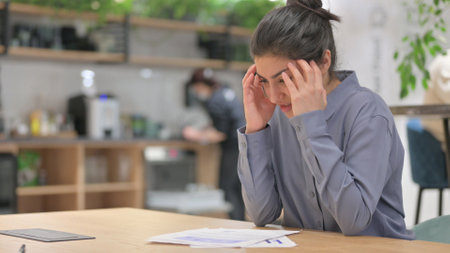 Frustrated Indian Woman Upset after Reading Documents