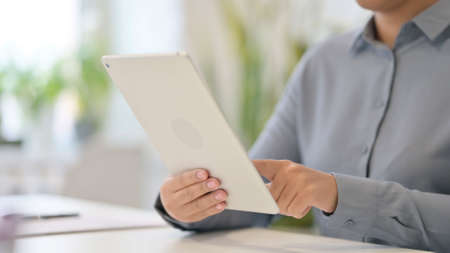 Close Up of African Woman using Digital Tabletの写真素材