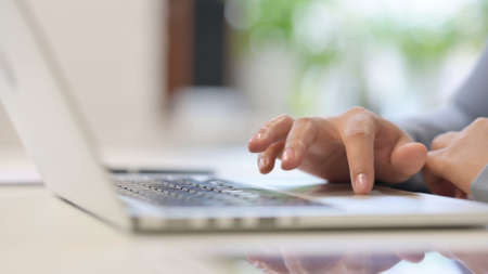 Hands Close Up of African Woman using Laptopの写真素材