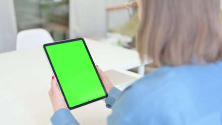 Woman using Tablet with Green Screen , Mock upの写真素材