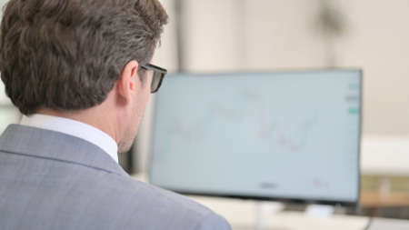 Businessman using Desktop, Working on Projectの写真素材