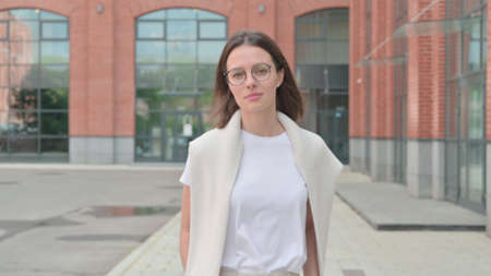 Close up of Young Woman Walking on Street, Slow Motionの写真素材
