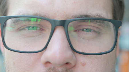 Close up of Blinking Eyes of Looking at Cameraの写真素材