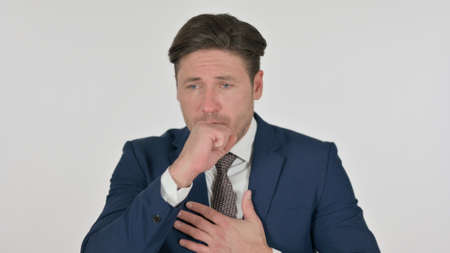 Sick Middle Aged Businessman Coughing, White Backgroundの写真素材