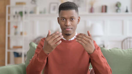 Portrait of African Man Pointing at the Camera and Inviting