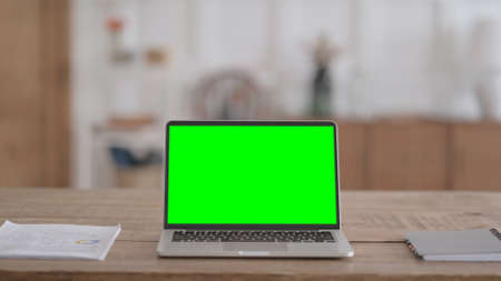 Rear View of Open Laptop with Green Chroma Screenの写真素材