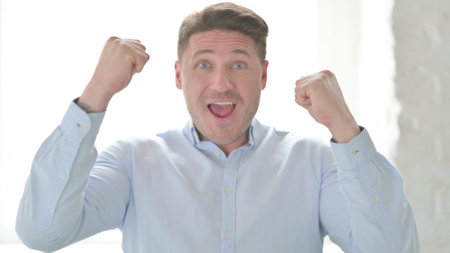 Portrait of Excited Man Celebrating Successの写真素材
