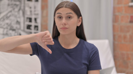 Portrait of Young Latina Woman Doing Thumbs Down