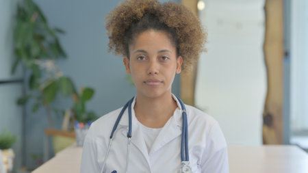 Portrait of Serious Female African Doctor in Clinicの写真素材