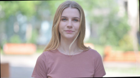 Outdoor Portrait of Young Woman in Denial, Stop Gesture