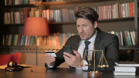 Male Lawyer Upset by Online Payment Failure on Phone in Office