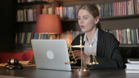 Female Lawyer Shocked by Loss on Laptopの写真素材