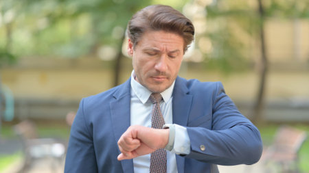 Outdoor Waiting Businessman Checking Time on Wrist Watch