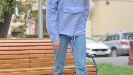 Woman Standing up and Leaving Bench Outdoor
