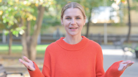 Confident Young Woman Doing Video Chat Outdoorの写真素材