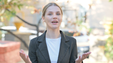 Blogging Young Businesswoman Doing Video Chat Outdoorの写真素材