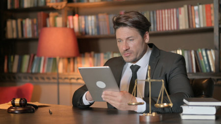 Male Lawyer using Tablet in Office
