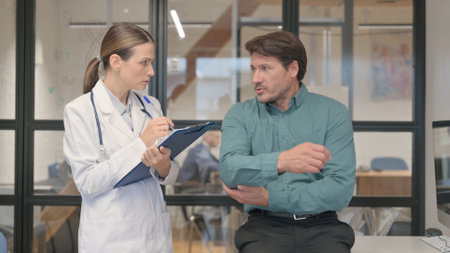 Woman with Elbow Pain Consulting an Orthopedic Doctor