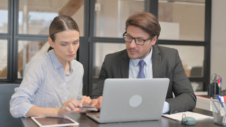 Business People Enjoying Online Shopping in Officeの写真素材