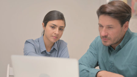Close up of Indian woman Working with Partnerの写真素材