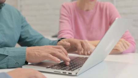 Close up of Creative People Hands Working on Laptopの写真素材