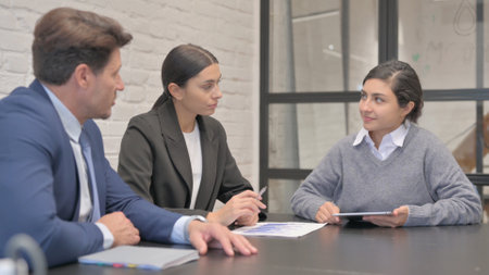 Indian Businesswoman Talking with Business People