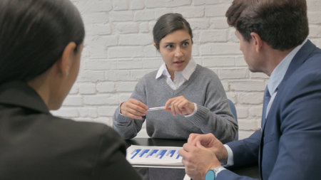 Close Up of Indian Businesswoman Talking with Business People