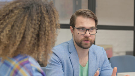 Close up of Businessman Talking with African Woman