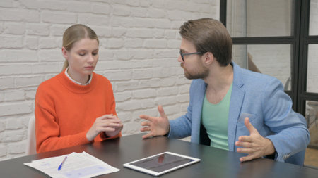 Angry Senior Businesswoman Talking with Employee in Officeの写真素材