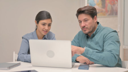 Multi Ethnic People Working Together on Laptop