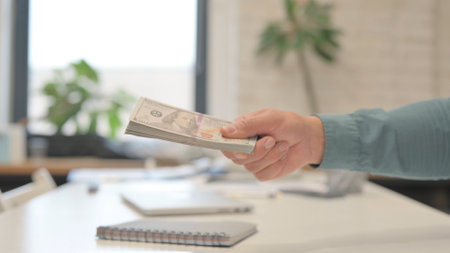 Close Up of Giving Money and Hand Shake