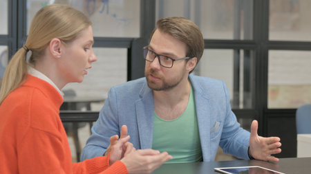 Close up of Senior Businesswoman in Discussion with Partnerの写真素材
