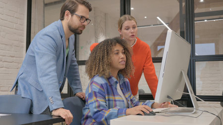 Young Entrepreneurs Working on Computer Together