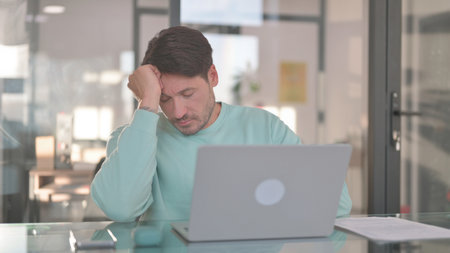 Tired Middle Aged Man Sleeping at Work