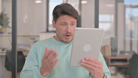 Portrait of Man with Loss on Tablet