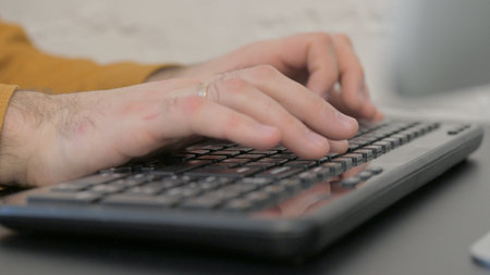 Hand Typing on Keyboard, Close Up