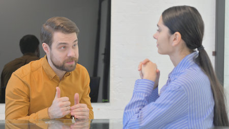 Angry Man in Argument with Mixed Race Teammateの写真素材