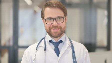 Portrait of Smiling Doctor in Clinicの写真素材