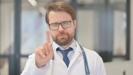 Portrait of Stopping Doctor Restricting Patientの写真素材