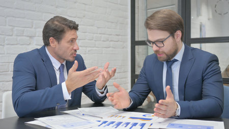 Angry Businessman Talking in Meeting with Teammateの写真素材