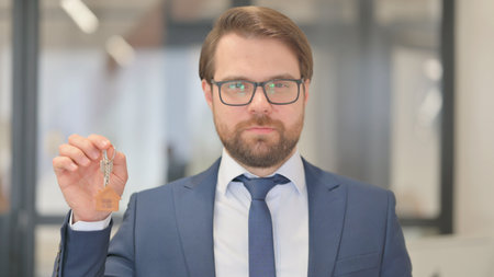 Portrait of Real Estate Agent Showing home Keysの写真素材